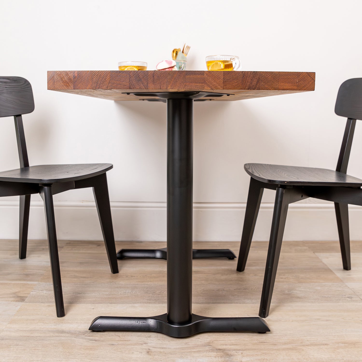 Solid Iroko Table with Black Pedestal Base