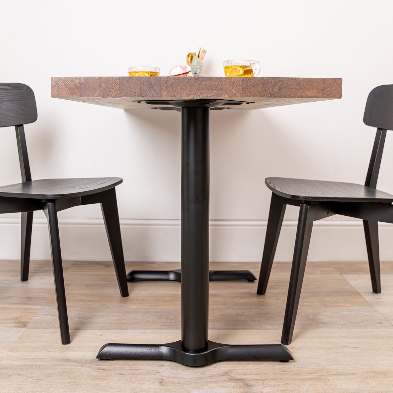 Solid Iroko Table with Black Pedestal Base Sanded